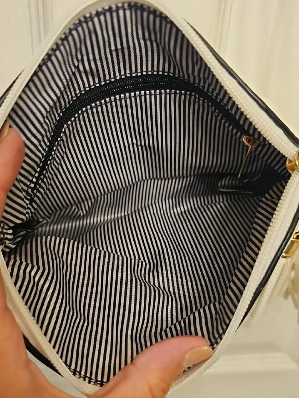 Two-Tone White and Black Crossbody Bag with Tassel Accent
